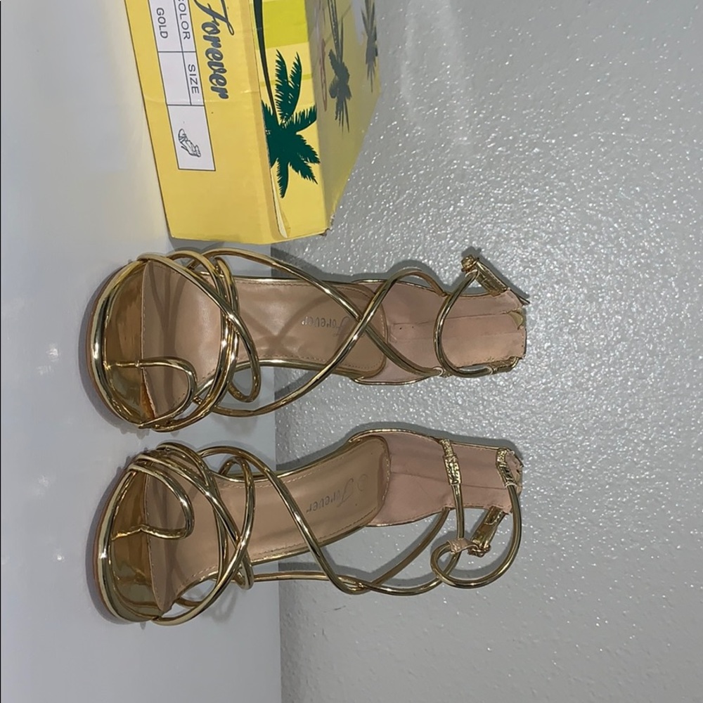 Gold strapped heels!